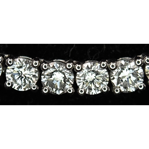 79 - A W.G.I. Certified 10k White Gold and Lab Grown Diamond Necklace. Set with 10.58ctw of 150 round bri... 