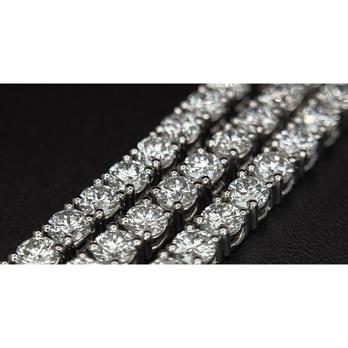 79 - A W.G.I. Certified 10k White Gold and Lab Grown Diamond Necklace. Set with 10.58ctw of 150 round bri... 