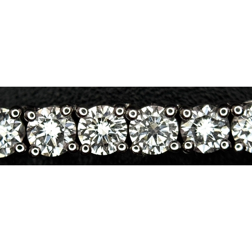 79 - A W.G.I. Certified 10k White Gold and Lab Grown Diamond Necklace. Set with 10.58ctw of 150 round bri... 