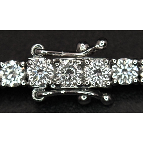 79 - A W.G.I. Certified 10k White Gold and Lab Grown Diamond Necklace. Set with 10.58ctw of 150 round bri... 