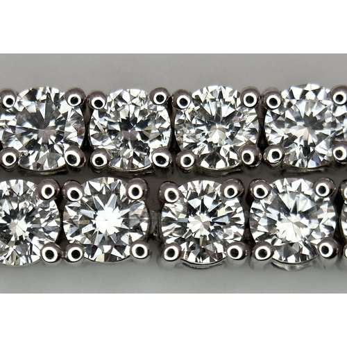 79 - A W.G.I. Certified 10k White Gold and Lab Grown Diamond Necklace. Set with 10.58ctw of 150 round bri... 