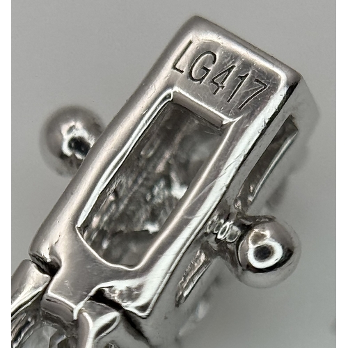 79 - A W.G.I. Certified 10k White Gold and Lab Grown Diamond Necklace. Set with 10.58ctw of 150 round bri... 