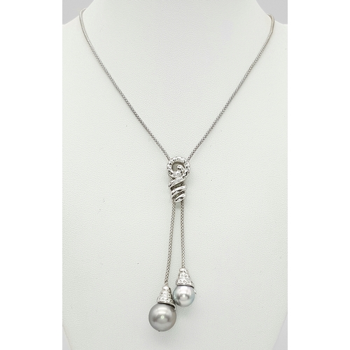 86 - An 18K White Gold, Pearl and Diamond Necklace. Fancy Venetian links with a diamond encrusted serpent... 