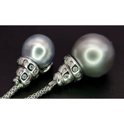 86 - An 18K White Gold, Pearl and Diamond Necklace. Fancy Venetian links with a diamond encrusted serpent... 