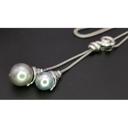 86 - An 18K White Gold, Pearl and Diamond Necklace. Fancy Venetian links with a diamond encrusted serpent... 
