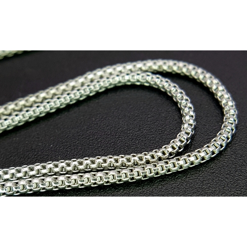 86 - An 18K White Gold, Pearl and Diamond Necklace. Fancy Venetian links with a diamond encrusted serpent... 