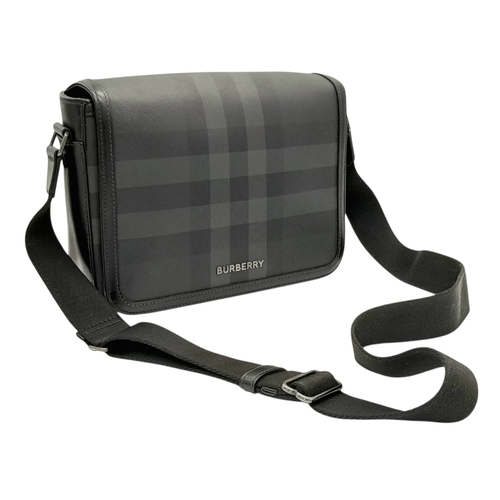 96 - A Burberry Black London Check Crossbody Bag. Black coated canvas exterior with silver-toned hardware... 