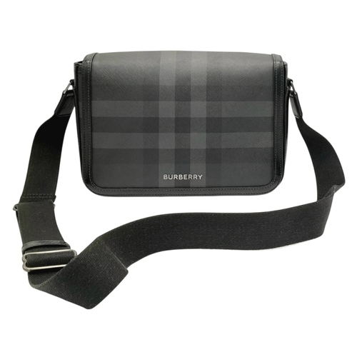 96 - A Burberry Black London Check Crossbody Bag. Black coated canvas exterior with silver-toned hardware... 