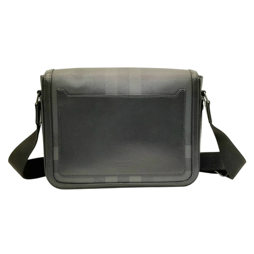 96 - A Burberry Black London Check Crossbody Bag. Black coated canvas exterior with silver-toned hardware... 