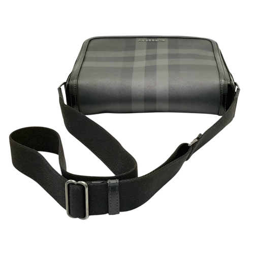 96 - A Burberry Black London Check Crossbody Bag. Black coated canvas exterior with silver-toned hardware... 