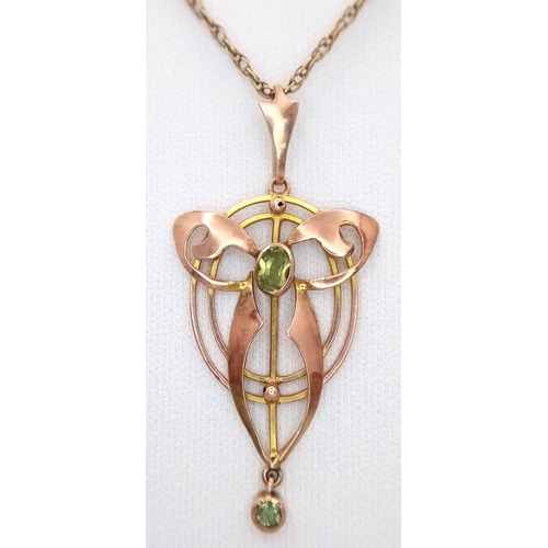 103 - An Antique Edwardian Pendant set with a Central Oval Cut Peridot. Stylistic open work design - 4.5cm... 