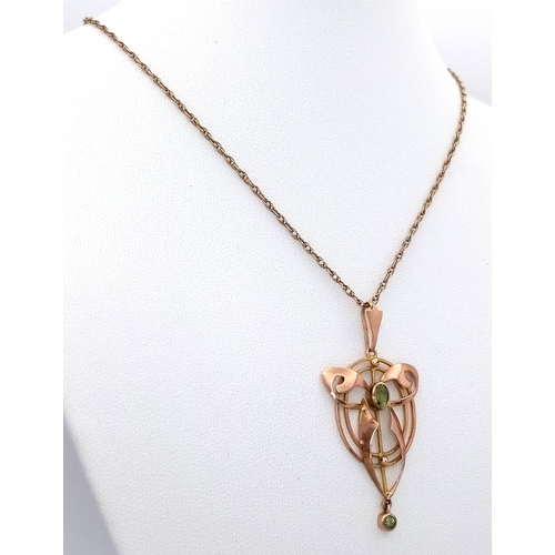 103 - An Antique Edwardian Pendant set with a Central Oval Cut Peridot. Stylistic open work design - 4.5cm... 