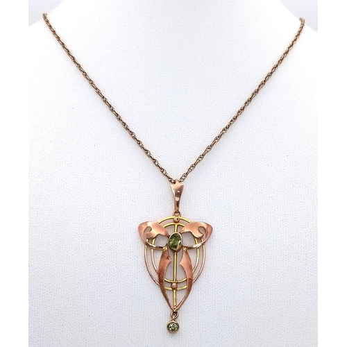 103 - An Antique Edwardian Pendant set with a Central Oval Cut Peridot. Stylistic open work design - 4.5cm... 