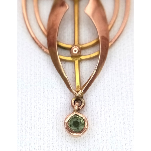 103 - An Antique Edwardian Pendant set with a Central Oval Cut Peridot. Stylistic open work design - 4.5cm... 