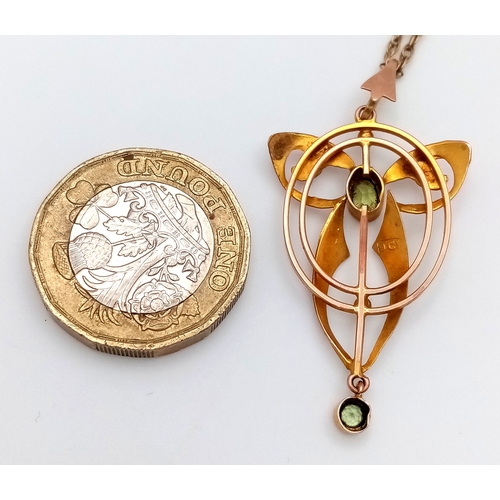 103 - An Antique Edwardian Pendant set with a Central Oval Cut Peridot. Stylistic open work design - 4.5cm... 