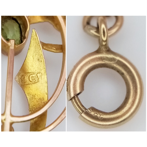 103 - An Antique Edwardian Pendant set with a Central Oval Cut Peridot. Stylistic open work design - 4.5cm... 