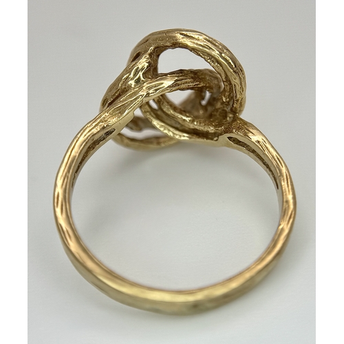 107 - A 9K Yellow Gold Swirl Ring. Size K. 3.2g.