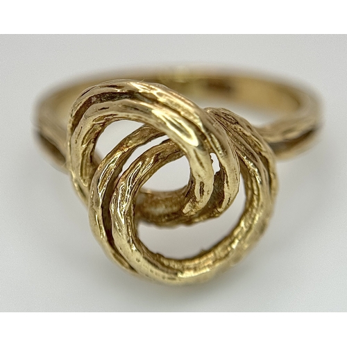107 - A 9K Yellow Gold Swirl Ring. Size K. 3.2g.