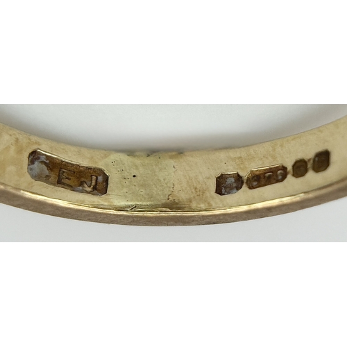 107 - A 9K Yellow Gold Swirl Ring. Size K. 3.2g.