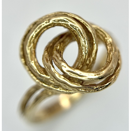 107 - A 9K Yellow Gold Swirl Ring. Size K. 3.2g.