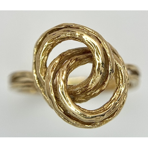 107 - A 9K Yellow Gold Swirl Ring. Size K. 3.2g.