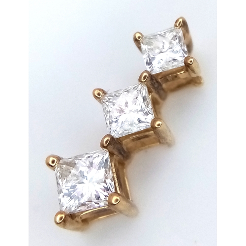 116 - A 14K Yellow Gold Graduating Diamond Pendant. c.1ctw of Princess cut diamonds. VS2/SI1 clarity. I-J ... 