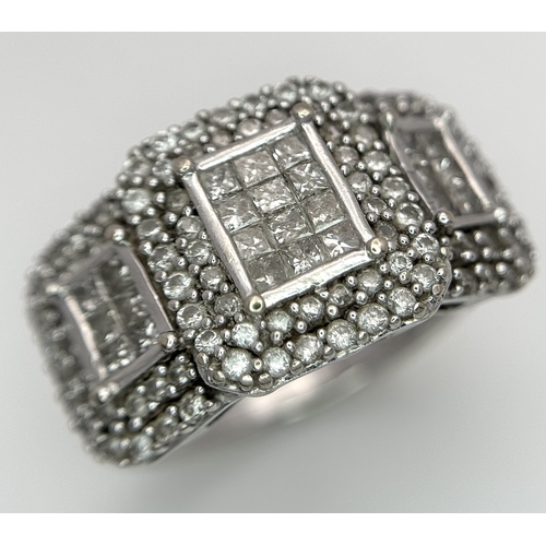 130 - An 18K White Gold Diamond Dress Ring. An array of pave round and princess cut diamonds c. 1.2ctw. Si... 