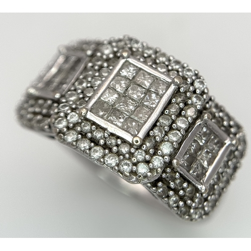130 - An 18K White Gold Diamond Dress Ring. An array of pave round and princess cut diamonds c. 1.2ctw. Si... 