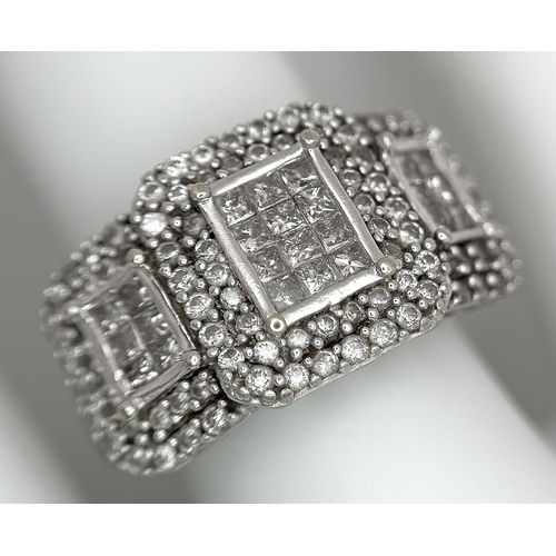 130 - An 18K White Gold Diamond Dress Ring. An array of pave round and princess cut diamonds c. 1.2ctw. Si... 