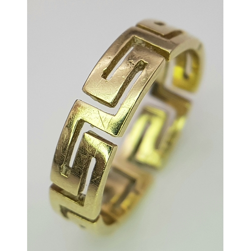136 - A 14K GOLD RING WITH GREEK KEY CUTOUT DESIGN.    3gms.    size O
