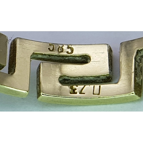 136 - A 14K GOLD RING WITH GREEK KEY CUTOUT DESIGN.    3gms.    size O