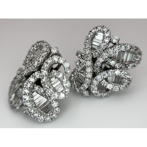 137 - A Fabulous Pair of 18K White Gold and Diamond Cocktail Earrings. Baguette and round brilliant cut in... 