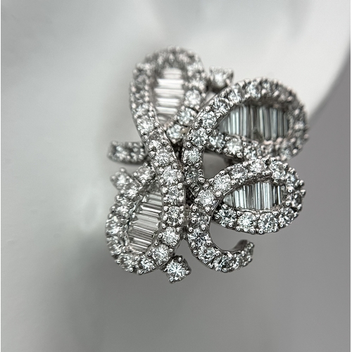 137 - A Fabulous Pair of 18K White Gold and Diamond Cocktail Earrings. Baguette and round brilliant cut in... 