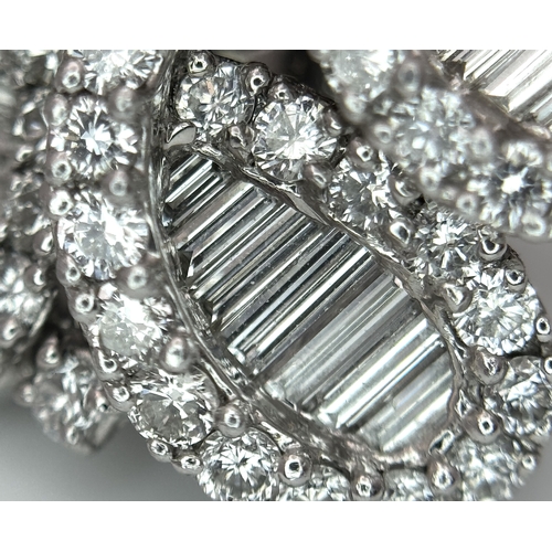 137 - A Fabulous Pair of 18K White Gold and Diamond Cocktail Earrings. Baguette and round brilliant cut in... 