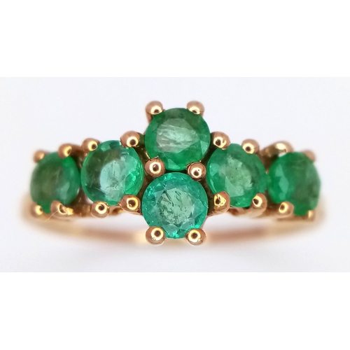 1045 - A 10 Carat Yellow Gold Zambian Emerald Ring-size Q. Set with Six 4mm Round Cut Emeralds, approximate... 