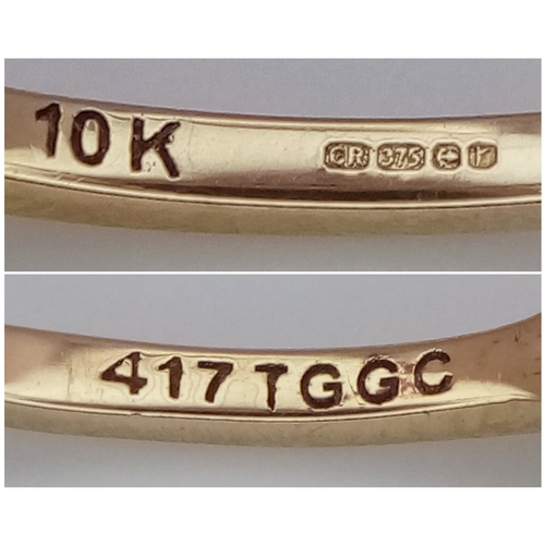 1045 - A 10 Carat Yellow Gold Zambian Emerald Ring-size Q. Set with Six 4mm Round Cut Emeralds, approximate... 