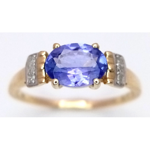 1059 - A Beautiful 10 Carat Yellow Gold Tanzanite and Diamond Set Ring Size N, set with a 7mm Oval Cut Tanz... 