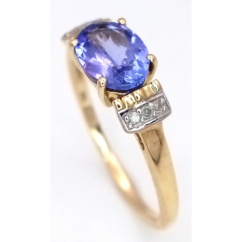 1059 - A Beautiful 10 Carat Yellow Gold Tanzanite and Diamond Set Ring Size N, set with a 7mm Oval Cut Tanz... 