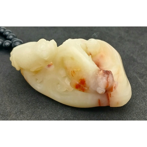 29 - Chinese Shoushan Stone (寿山石) Carving with Beaded Necklace.
A polished Shoushan stone carving from Fu... 