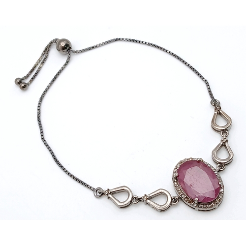 67 - An Oval Cut 8ct Ruby with Diamond Accents Set in 925 Silver bracelet. Adjustable. CD-2017.