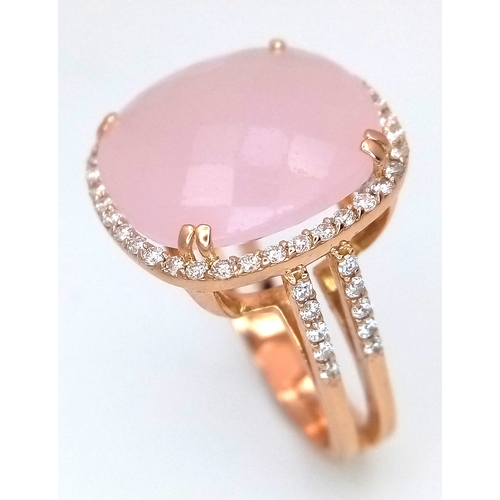 149 - An 18K White Gold, Pink Moonstone and Diamond Cocktail Ring. Cushion cut faceted c.12ct moonstone wi... 
