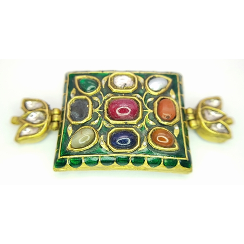 An Antique Indian Mughal Bazuband (armband) Gem-Set Piece That Has Been Converted Into a Pendant. Features a high Karat gold base with detailed enamel work and Navaratna style gemstones including: Diamond, coral, ruby, emerald, pearl, sapphire, topaz, cat's eye and zircon. 6.5cm x 3cm. 28g total weight. NS13.
