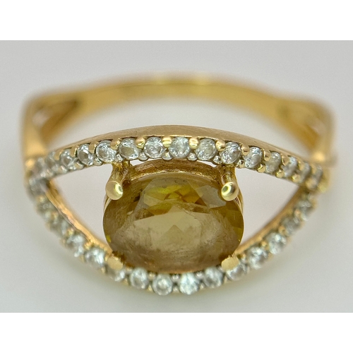 533 - A 14K Yellow Gold, Green stone (possibly tourmaline) and White Stone Ring in Eye Form. 1.75ct oval c... 