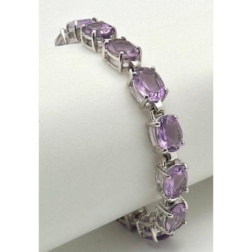 550 - An Attractive Sterling Silver and Large Amethyst Set Tennis Bracelet-19.5cm Length. The Bracelet is ... 