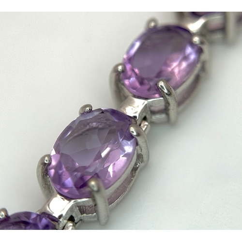 550 - An Attractive Sterling Silver and Large Amethyst Set Tennis Bracelet-19.5cm Length. The Bracelet is ... 