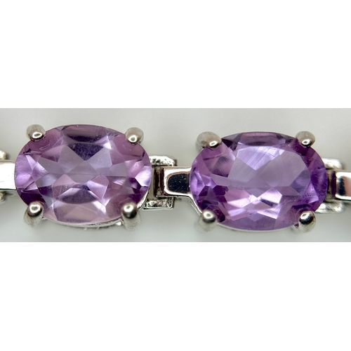 550 - An Attractive Sterling Silver and Large Amethyst Set Tennis Bracelet-19.5cm Length. The Bracelet is ... 