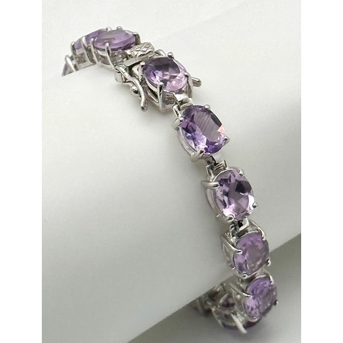 550 - An Attractive Sterling Silver and Large Amethyst Set Tennis Bracelet-19.5cm Length. The Bracelet is ... 