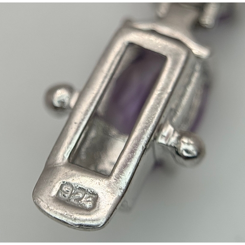550 - An Attractive Sterling Silver and Large Amethyst Set Tennis Bracelet-19.5cm Length. The Bracelet is ... 