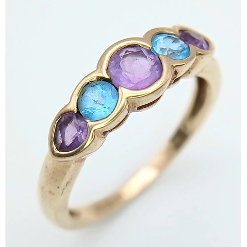 505 - A 9K GOLD RING WITH AMETHYST AND AQUAMARINE STONES .      2.2gms    size M
