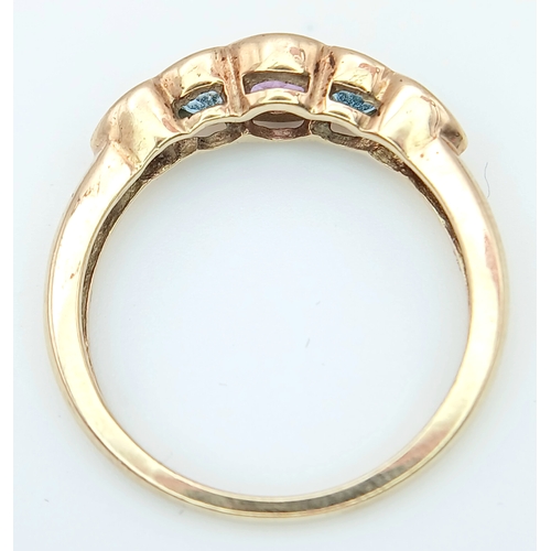 505 - A 9K GOLD RING WITH AMETHYST AND AQUAMARINE STONES .      2.2gms    size M